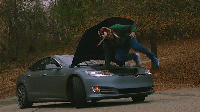 DJ Many with a Tesla