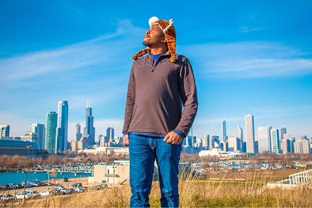 DJ Many with the Chicago skyline
