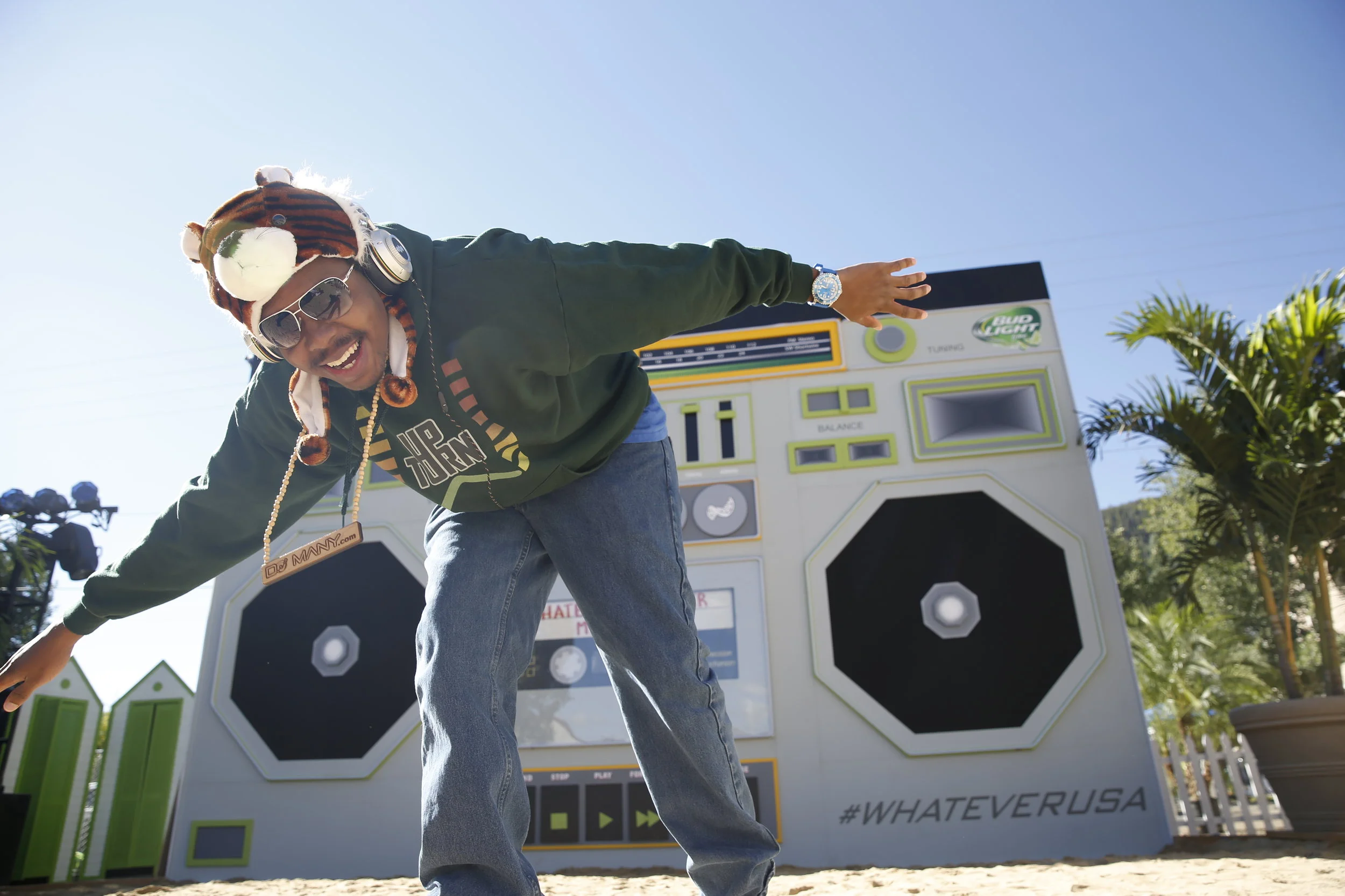 DJ Many with boombox at dusk